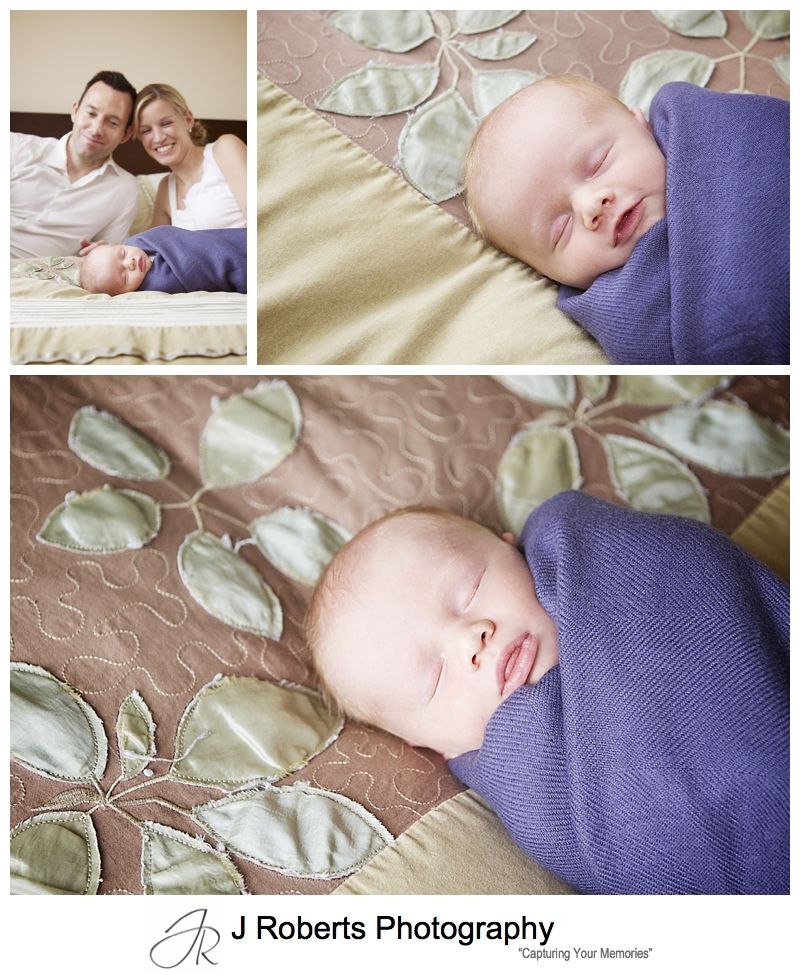 Baby wrapped and sleeping on parents bed - sydney baby portrait photographer 